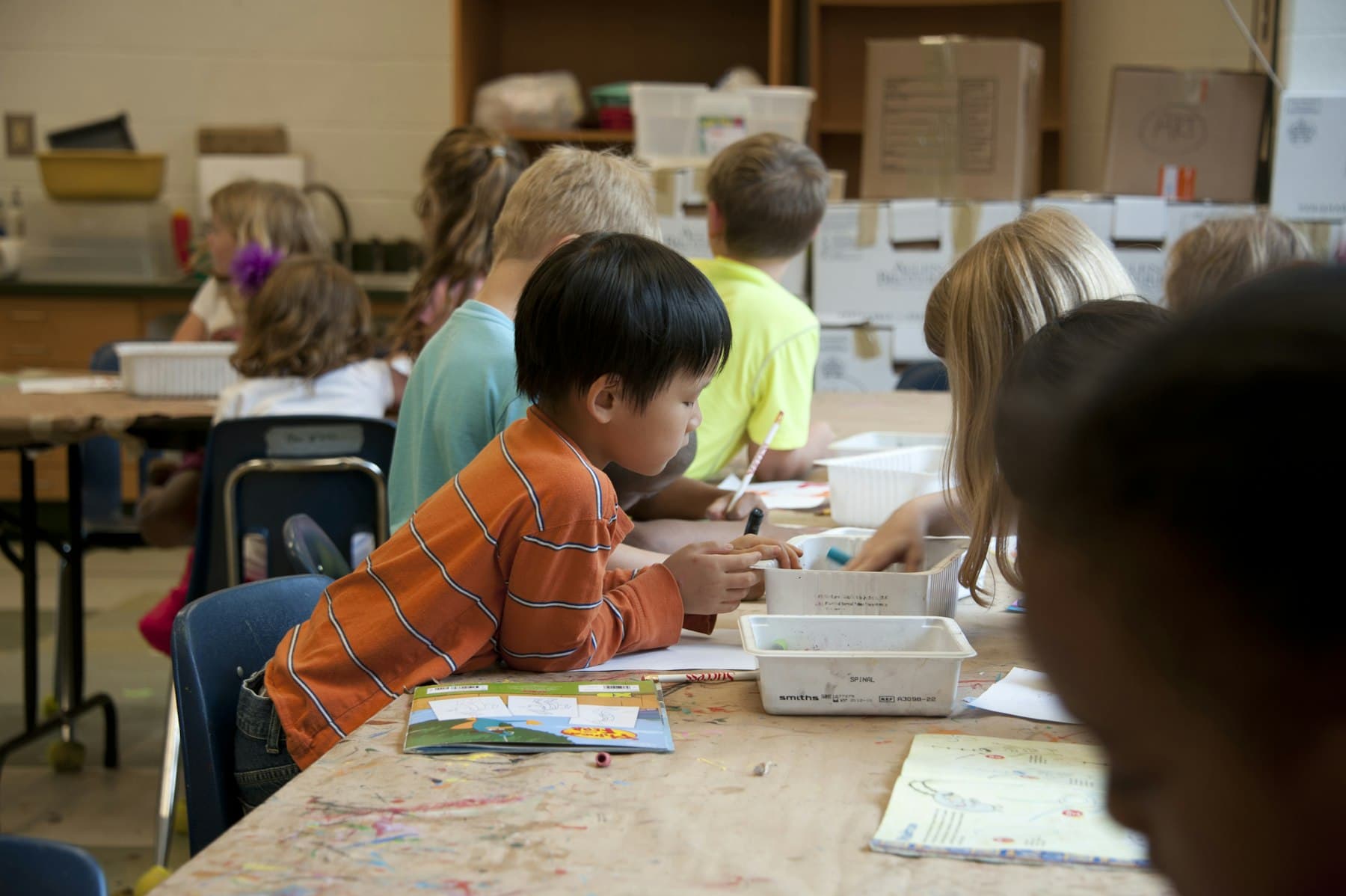 Children working together at their desks in a lesson